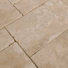 Cream travertine paving slabs in beige